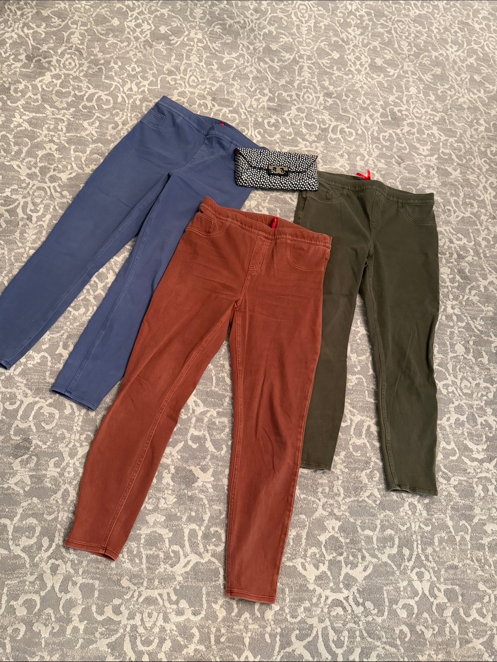 Three SPANX Pull-On Skinny Pants in Blue, Rust, and Olive